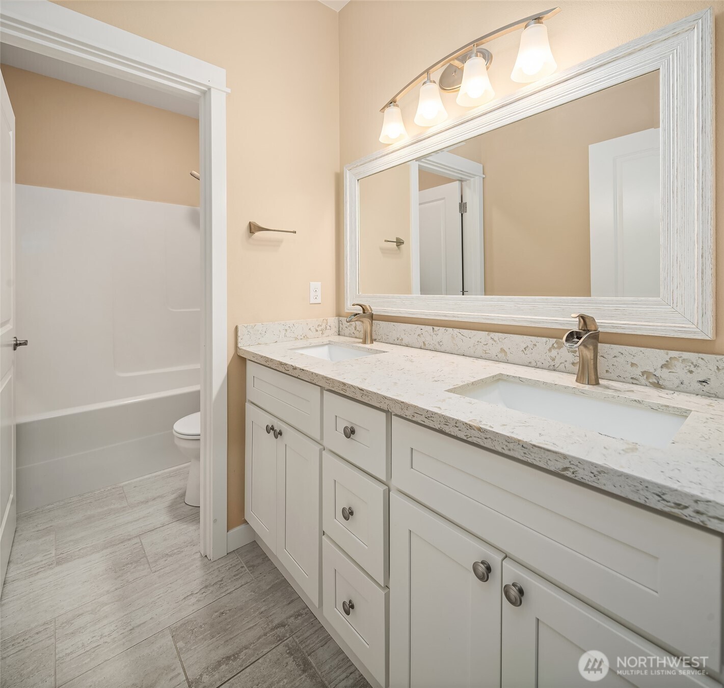 216 Cornwall Road Northwest Lakebay, WA 98349 - Photo 24 of 34 a spacious bathroom with a granite countertop sink a toilet and a bathtub