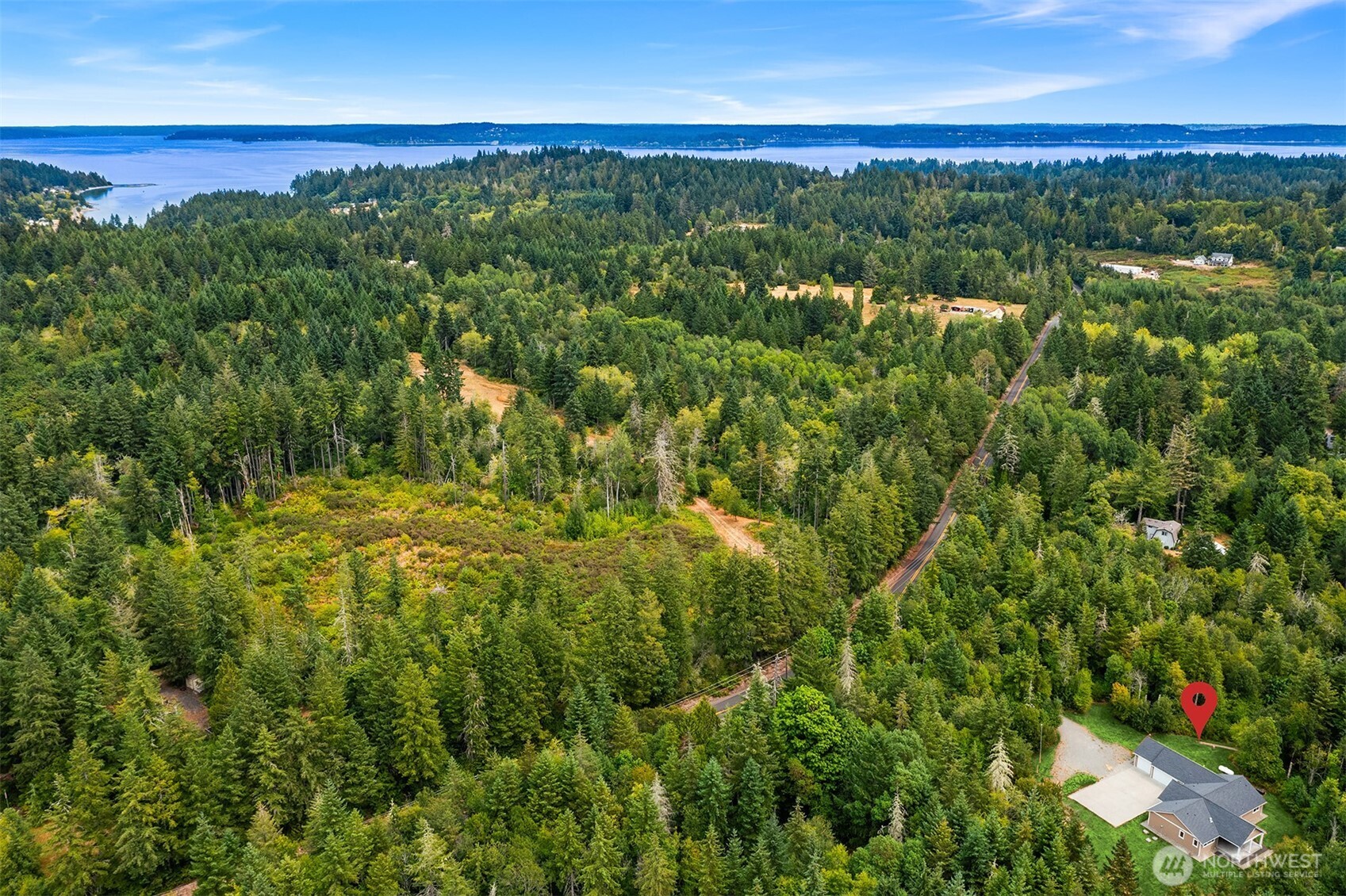 216 Cornwall Road Northwest Lakebay, WA 98349 - Photo 34 of 34 a view of a city with lush green forest