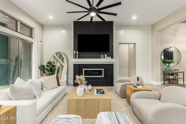 a view of a livingroom with furniture and a window
