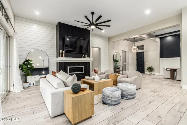 a bed room with a bed and a chandelier