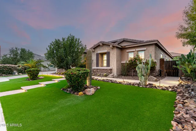 a living room with stainless steel appliances kitchen island furniture and a view of kitchen