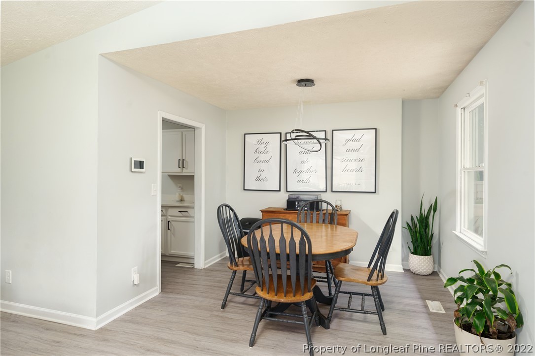 1742 Rim Road Fayetteville, NC 28314 - Photo 12 of 21 a dining room with furniture and window