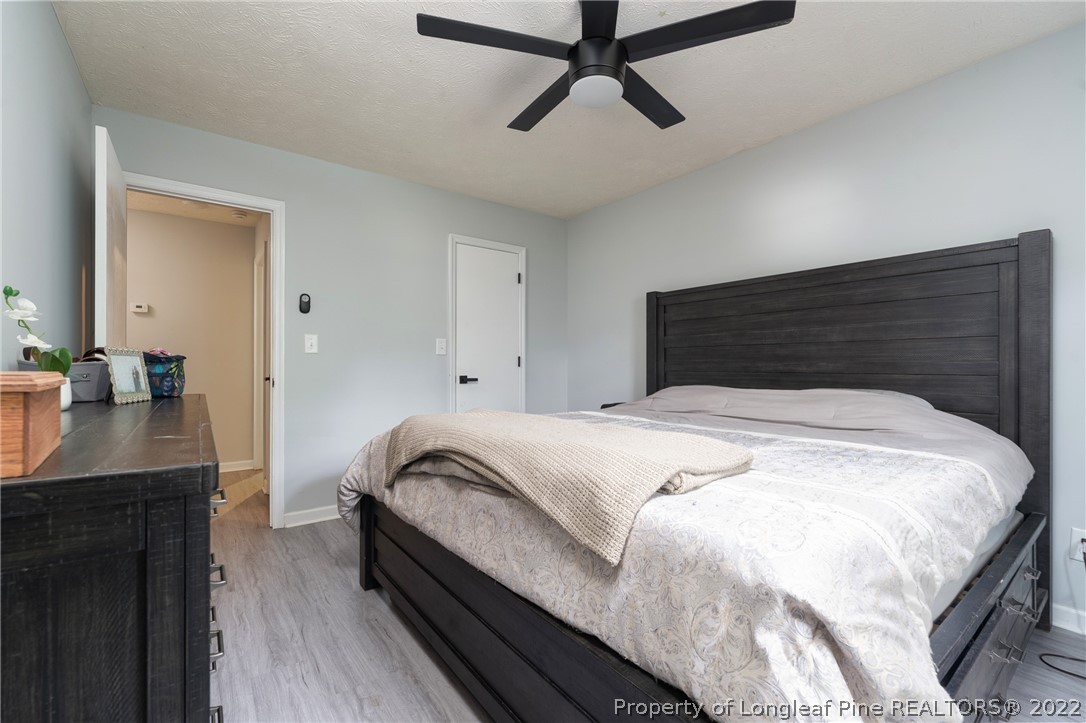 1742 Rim Road Fayetteville, NC 28314 - Photo 20 of 21 a bedroom with a bed and a dresser