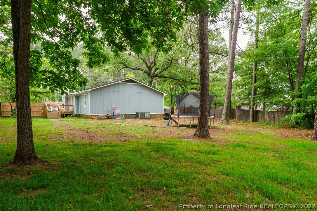 1742 Rim Road Fayetteville, NC 28314 - Photo 6 of 21 a view of house with backyard and trees