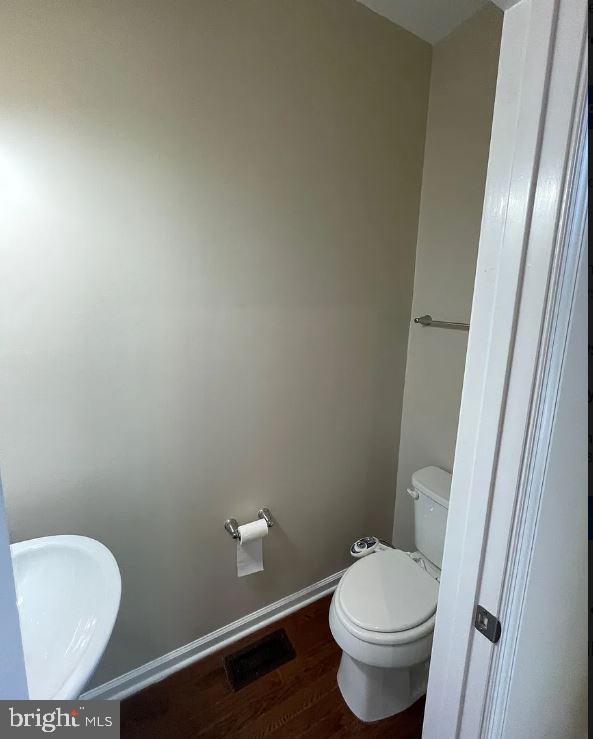 43855 Stubble Cor Square Ashburn, VA 20147 - Photo 11 of 38 a white toilet sitting next to a small bathroom