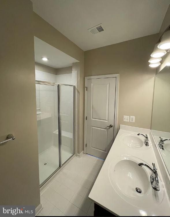 43855 Stubble Cor Square Ashburn, VA 20147 - Photo 16 of 38 a bathroom with a sink and a shower