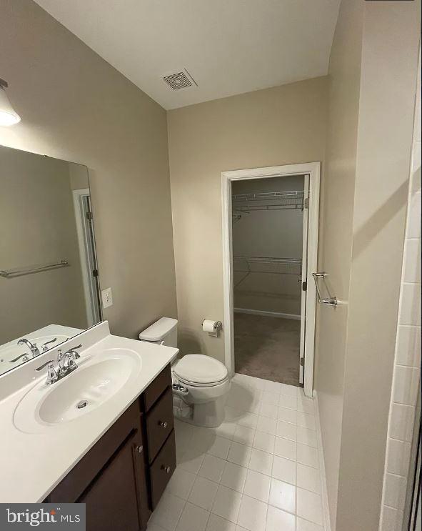 43855 Stubble Cor Square Ashburn, VA 20147 - Photo 17 of 38 a bathroom with a sink a toilet and shower