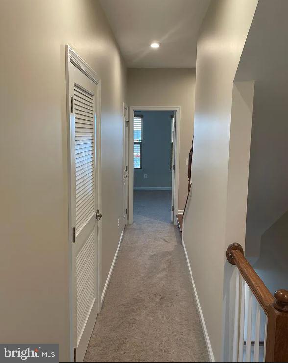 43855 Stubble Cor Square Ashburn, VA 20147 - Photo 21 of 38 a view of hallway with stairs