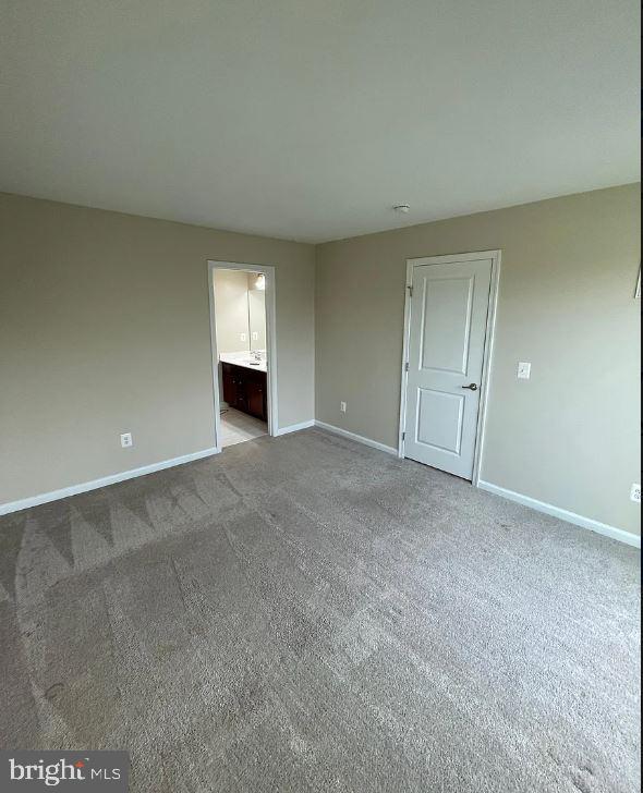 43855 Stubble Cor Square Ashburn, VA 20147 - Photo 29 of 38 a view of an empty room with a fireplace