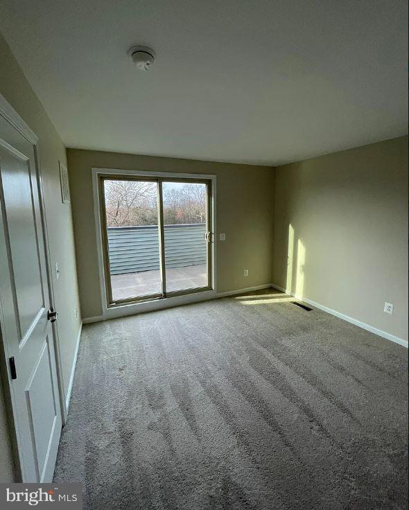 43855 Stubble Cor Square Ashburn, VA 20147 - Photo 30 of 38 an empty room with windows and entrance
