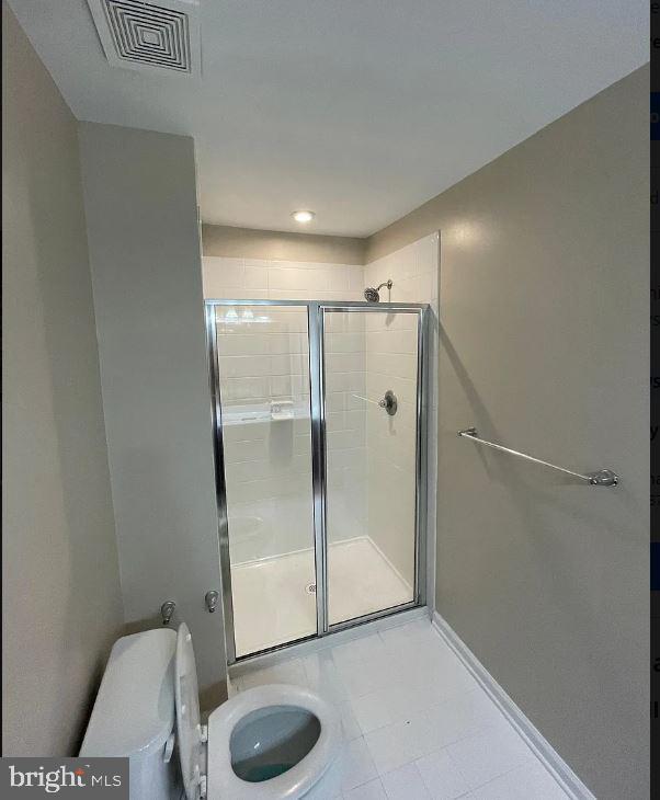 43855 Stubble Cor Square Ashburn, VA 20147 - Photo 33 of 38 a bathroom with a shower and a toilet