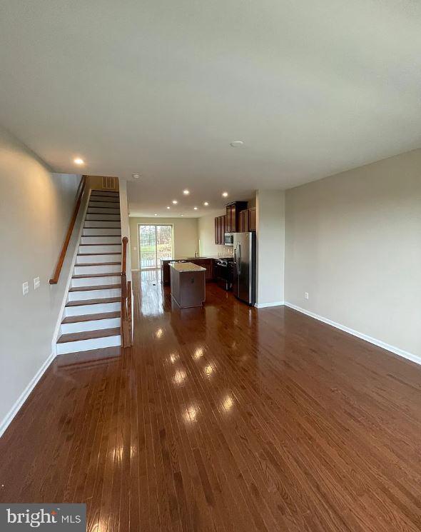 43855 Stubble Cor Square Ashburn, VA 20147 - Photo 7 of 38 a view of a hallway with wooden floor
