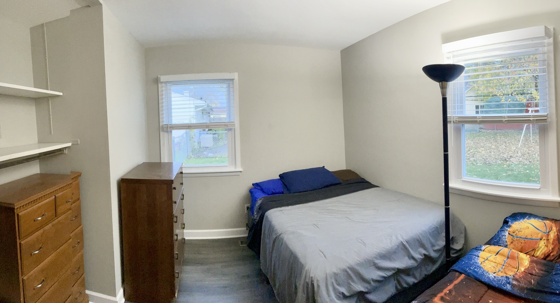 67 Stratford Road Montgomery, IL 60538 - Photo 15 of 33 a bedroom with a bed and wooden floor