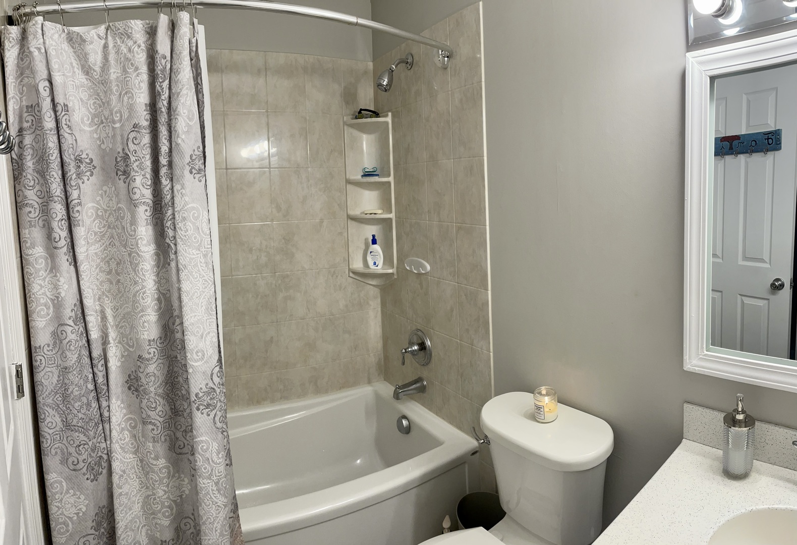 67 Stratford Road Montgomery, IL 60538 - Photo 19 of 33 a bathroom with a shower curtain and a sink