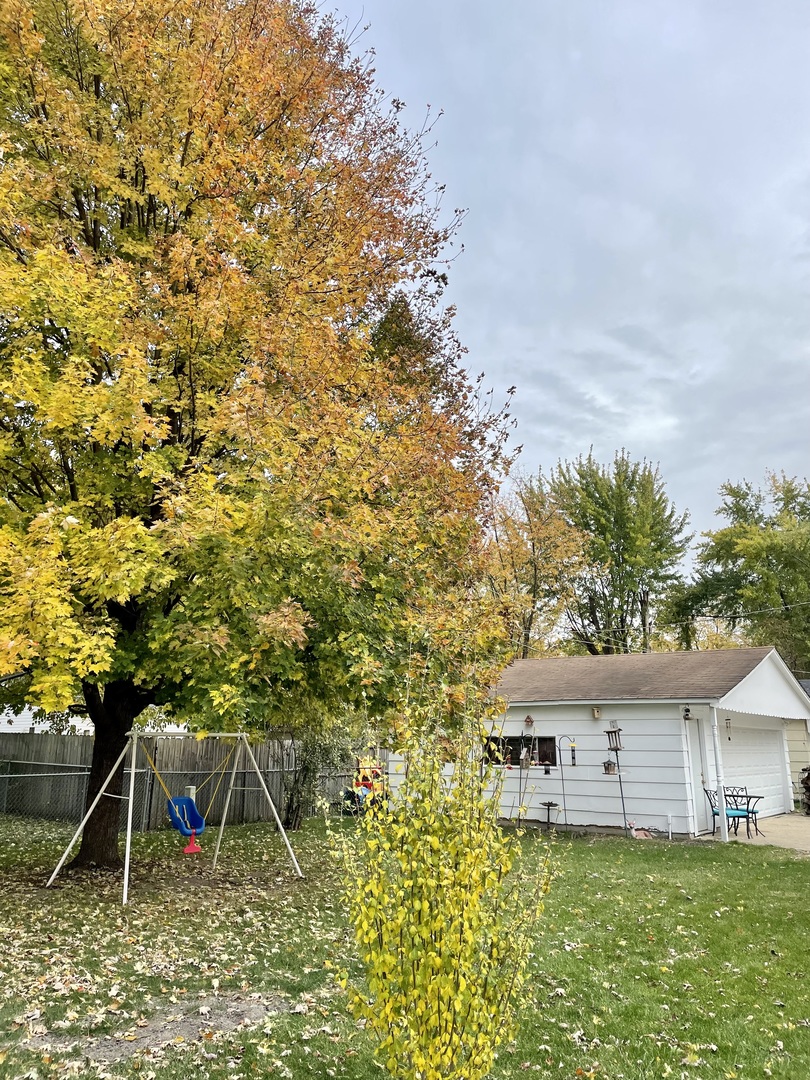 67 Stratford Road Montgomery, IL 60538 - Photo 26 of 33 a view of a house with a yard and sitting area