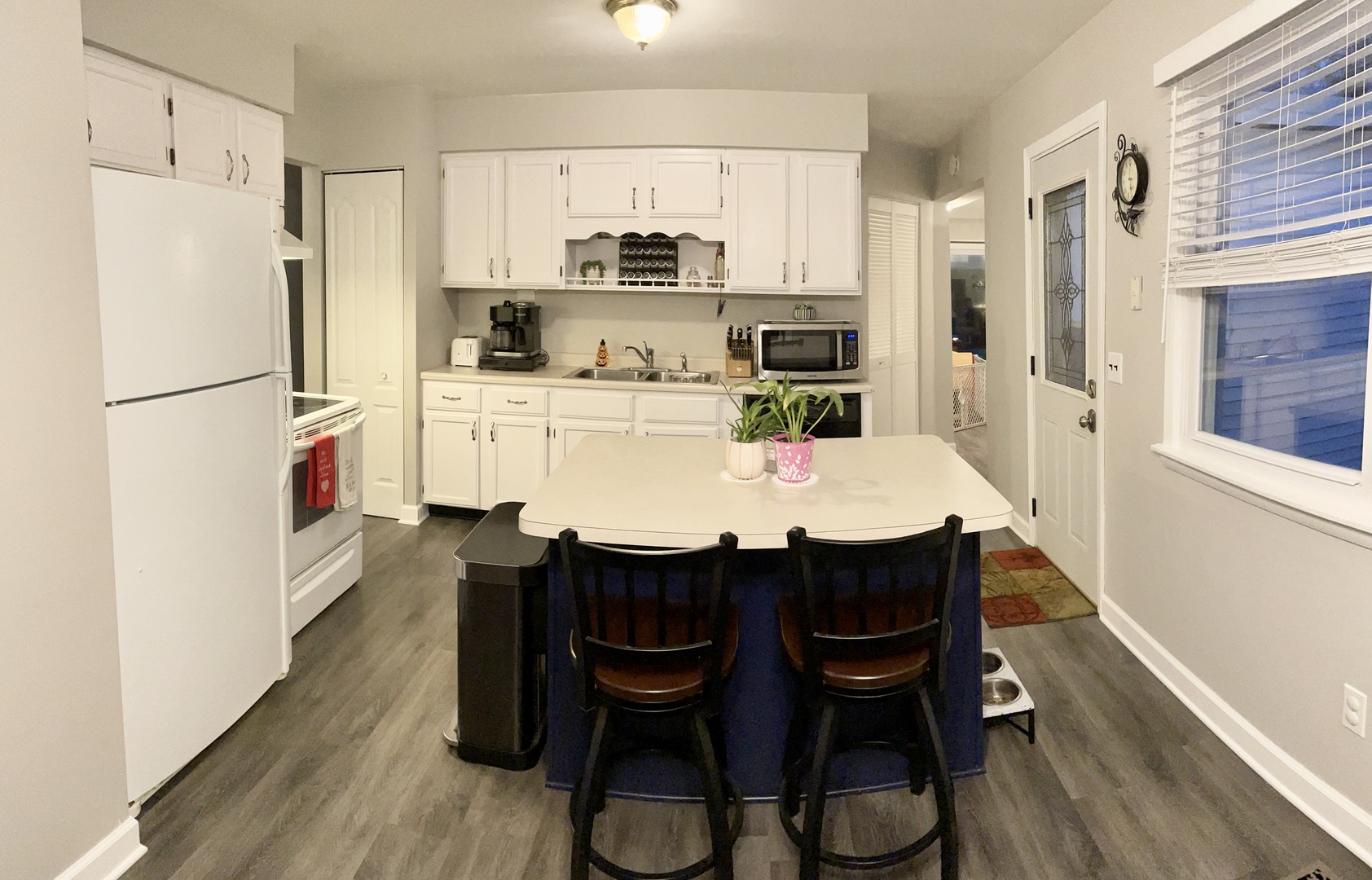 67 Stratford Road Montgomery, IL 60538 - Photo 6 of 33 a kitchen with stainless steel appliances a table chairs and a refrigerator