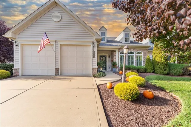a view of a white house with a tub and garden view