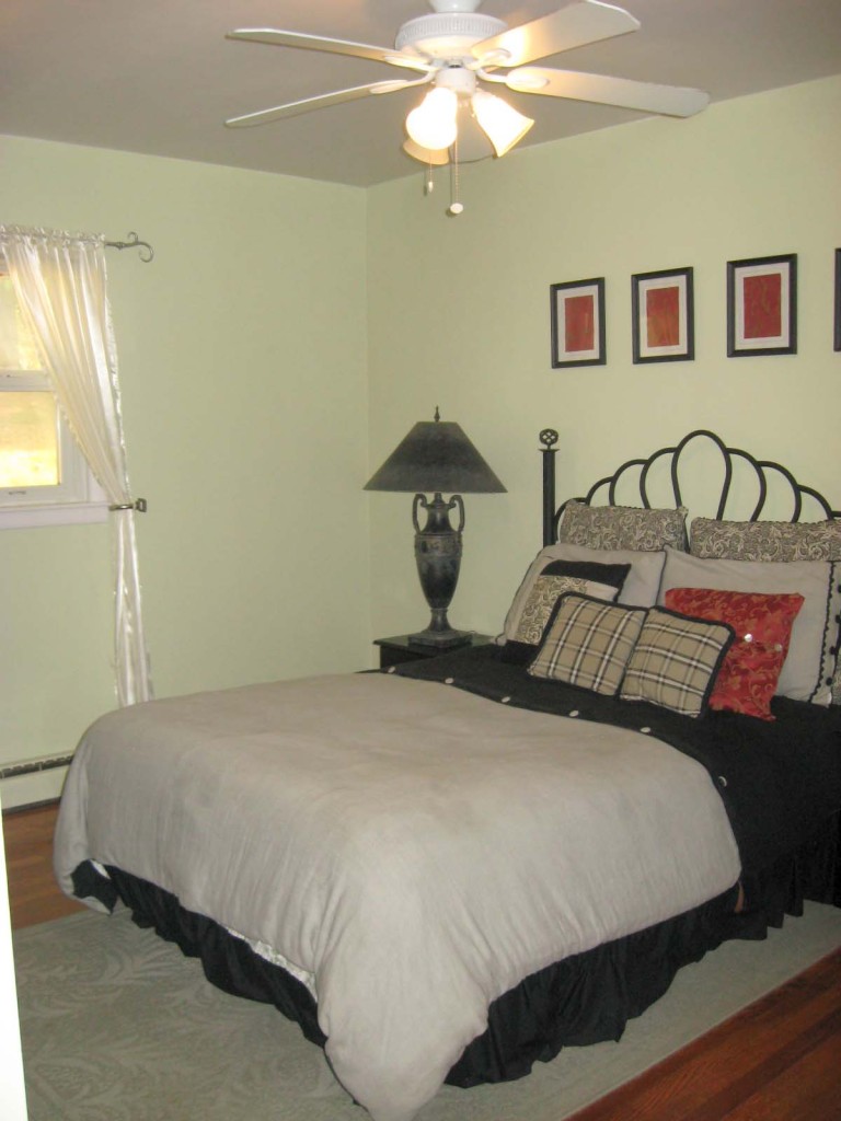 396 Barberry Road Southeast Floyd, VA 24091 - Photo 8 of 11 a bedroom with a bed and a chandelier