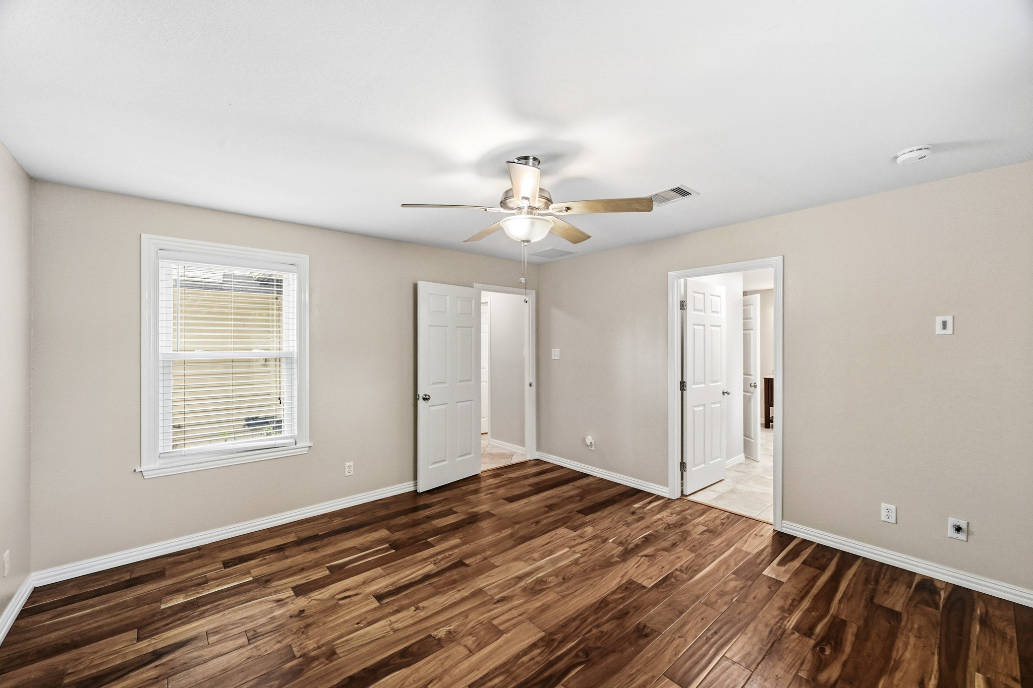 3602 Sweet Gum Spring, TX 77388 - Photo 16 of 30 wooden floor in an empty room with a window