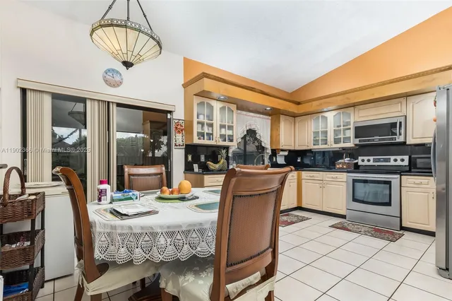 a kitchen with stainless steel appliances granite countertop a stove and a sink