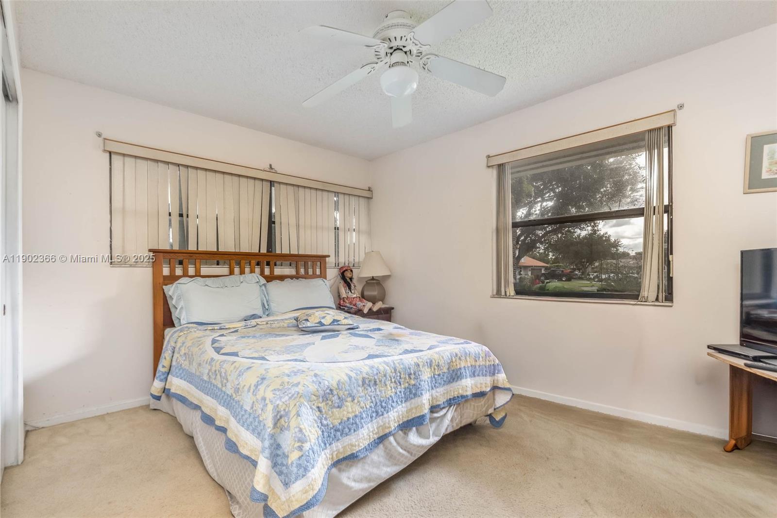 5641 Thistledown Terrace Davie, FL 33331 - Photo 21 of 36 a bedroom with a bed and a painting on the wall