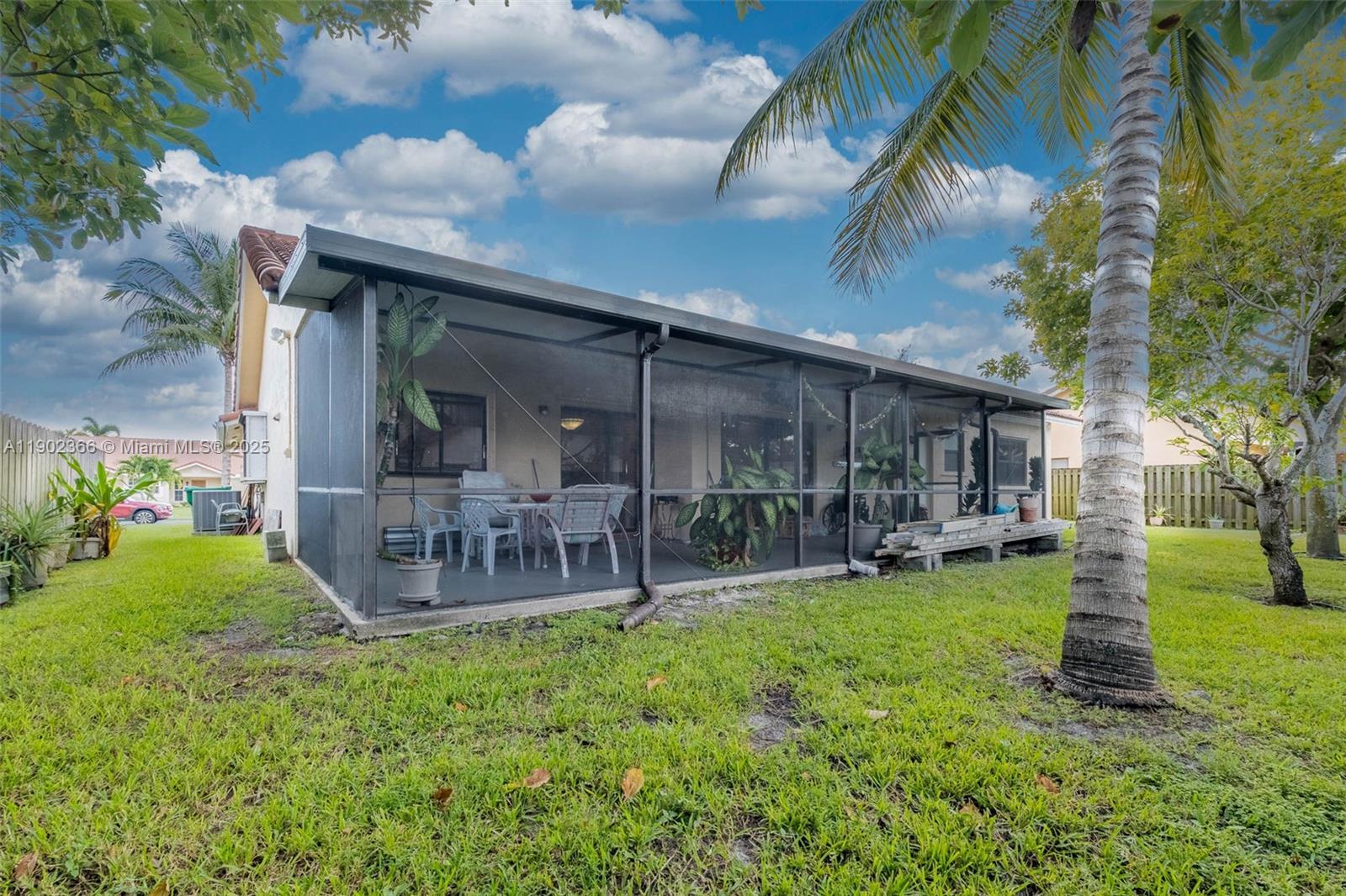 5641 Thistledown Terrace Davie, FL 33331 - Photo 24 of 36 a view of a house with a yard and sitting area