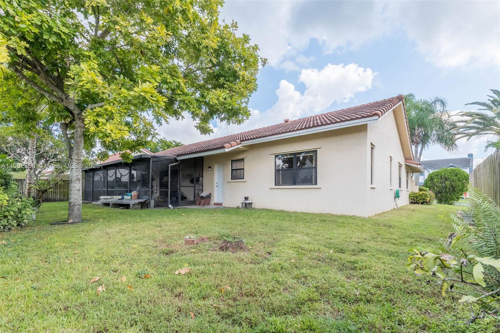 5641 Thistledown Terrace Davie, FL 33331 - Photo 25 of 36 a view of a house with a yard