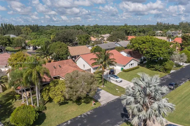 an aerial view of a houses with outdoor space