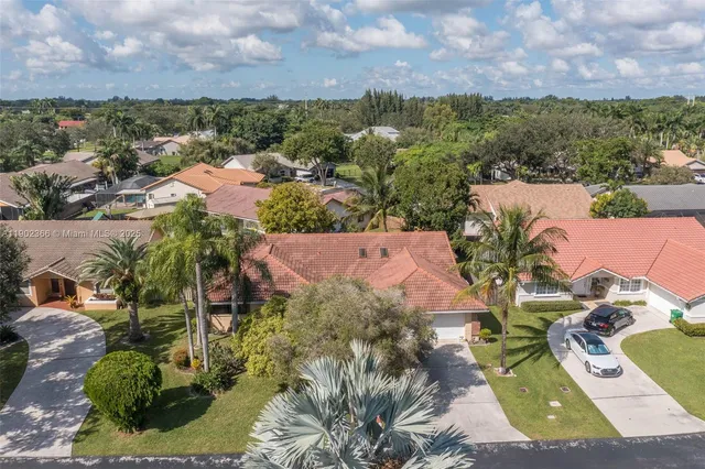 an aerial view of a house with a garden
