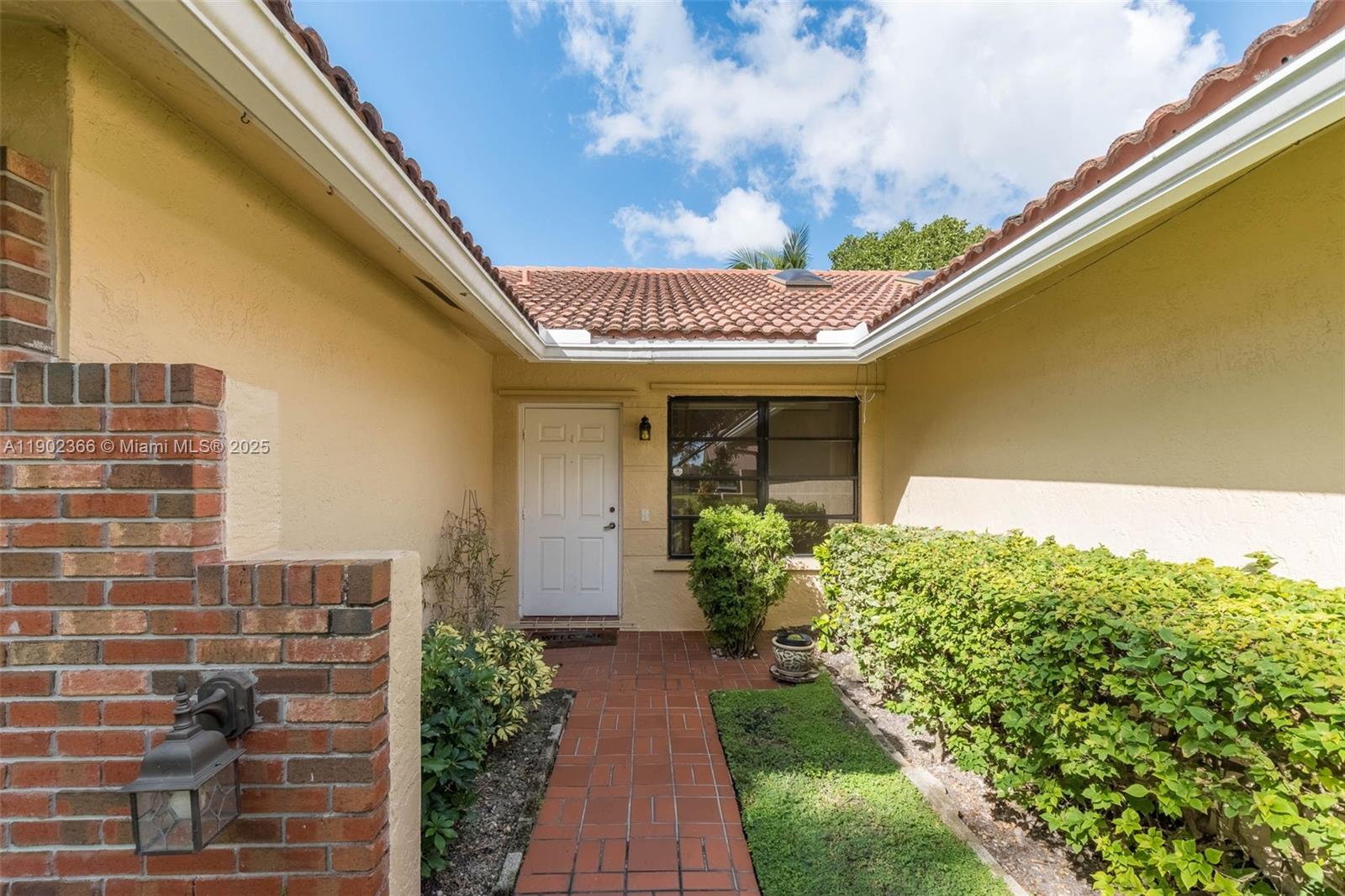 5641 Thistledown Terrace Davie, FL 33331 - Photo 5 of 36 a front view of a house with garden
