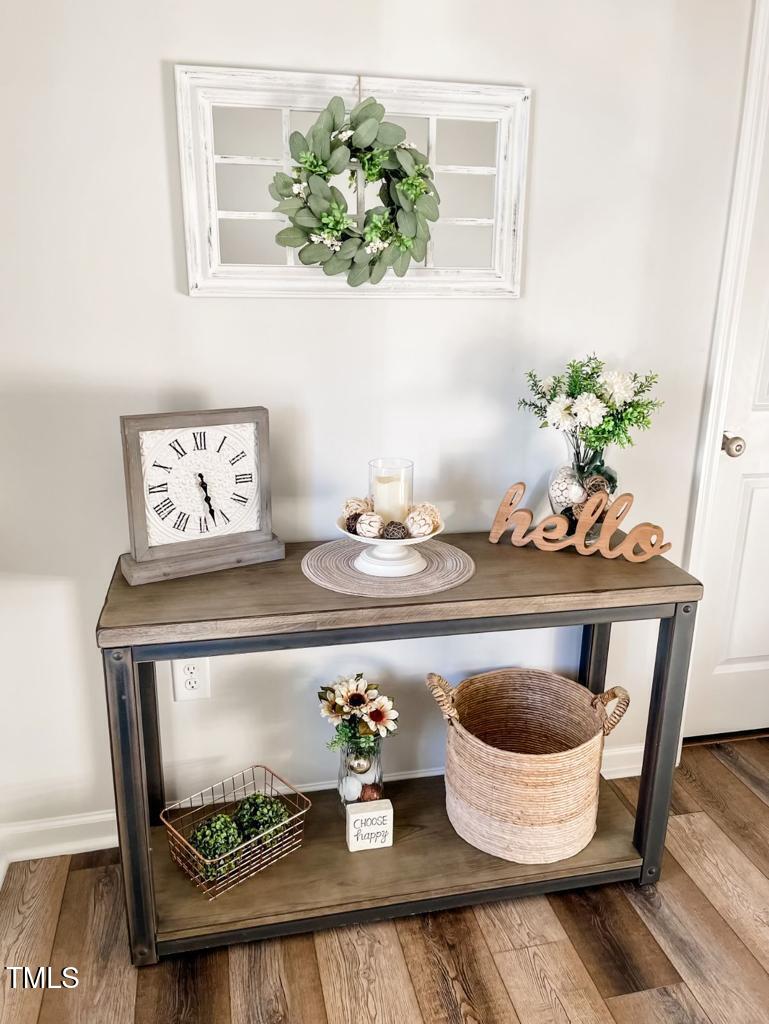 1346 Rosepine Drive Cary, NC 27519 - Photo 12 of 28 a dining room with furniture potted plants and wooden floor