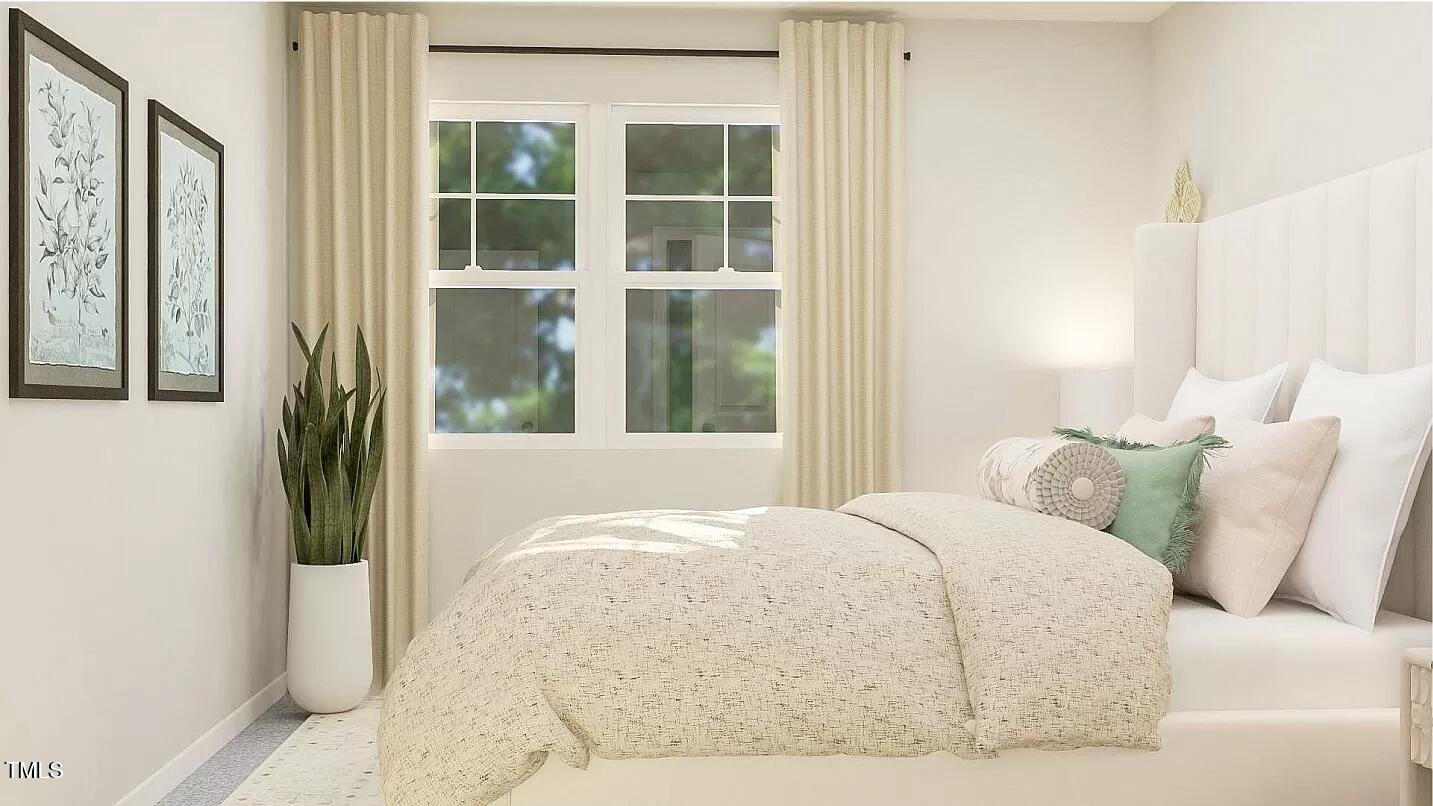 1346 Rosepine Drive Cary, NC 27519 - Photo 22 of 28 a bed sitting in a bedroom next to a window