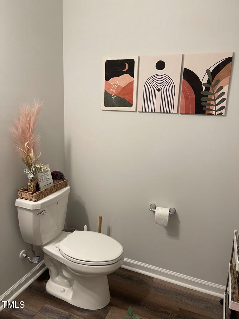 1346 Rosepine Drive Cary, NC 27519 - Photo 23 of 28 a white toilet sitting next to a bathroom sink