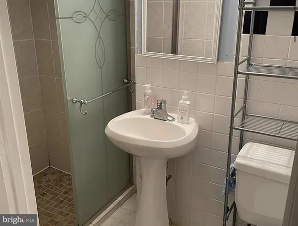 a bathroom with a sink toilet