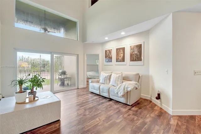 a kitchen with stainless steel appliances a refrigerator sink and cabinets
