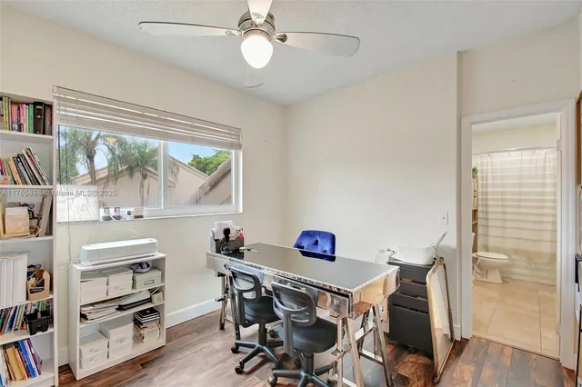a bedroom with a bed couch and a flat screen tv