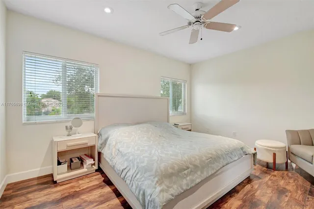 a white toilet sitting next to a shower curtain