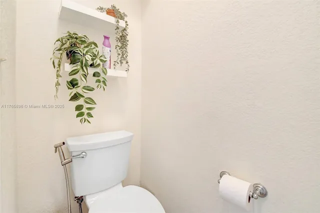 a view of room with window and wooden floor