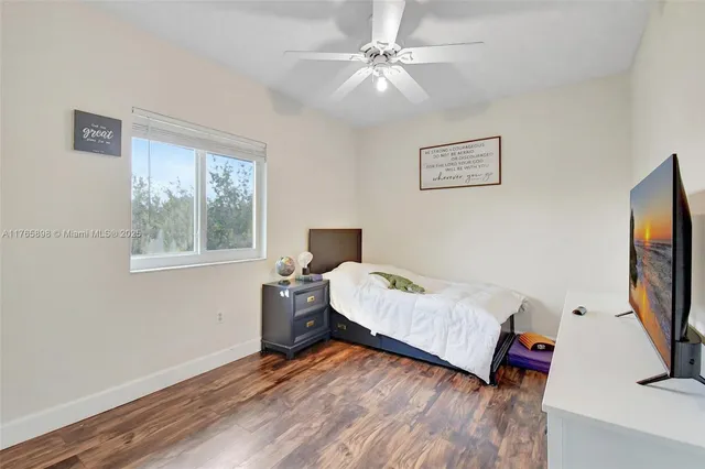 an aerial view of residential houses with outdoor space and river