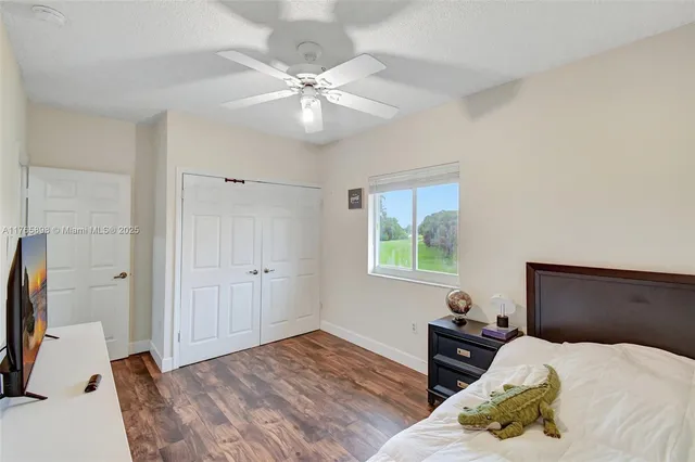 an aerial view of residential houses with outdoor space and river