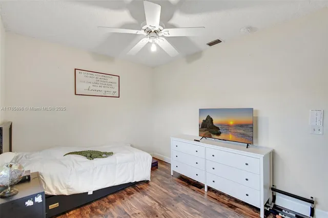 an aerial view of residential houses with outdoor space and river