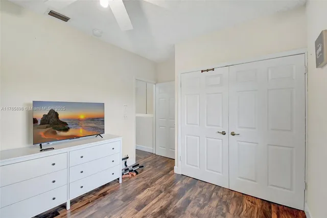 an aerial view of residential houses with outdoor space and river