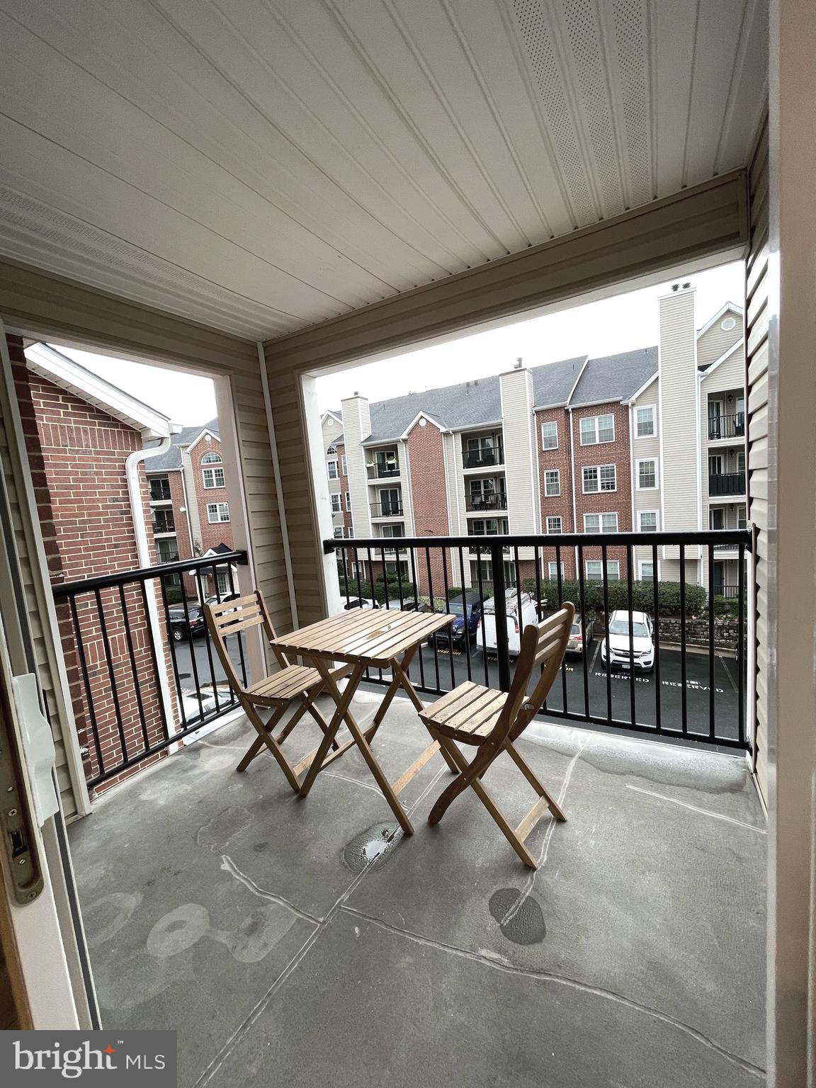 3310 Wyndham Circle, Unit 314 Alexandria, VA 22302 - Photo 11 of 31 a view of a patio with chairs and table