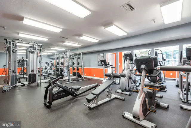 a living room with fireplace furniture and a flat screen tv