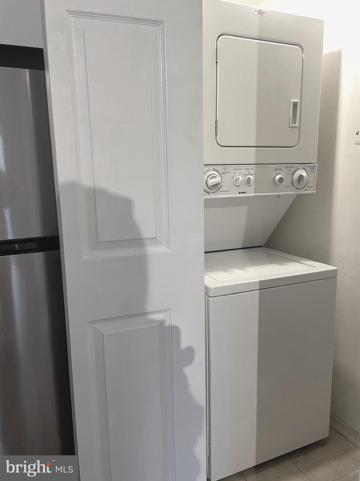 3310 Wyndham Circle, Unit 314 Alexandria, VA 22302 - Photo 10 of 31 a utility room with dryer and washer