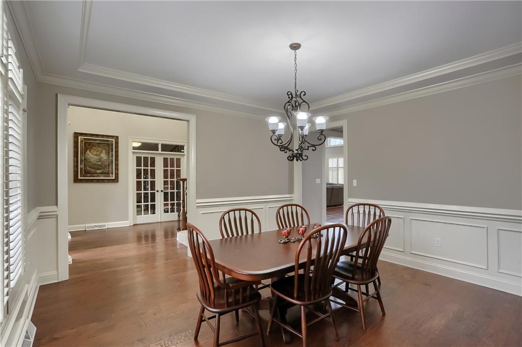 200 Longbow Lane Mars, PA 16046 - Photo 14 of 50 a view of a dining room with furniture a chandelier and wooden floor