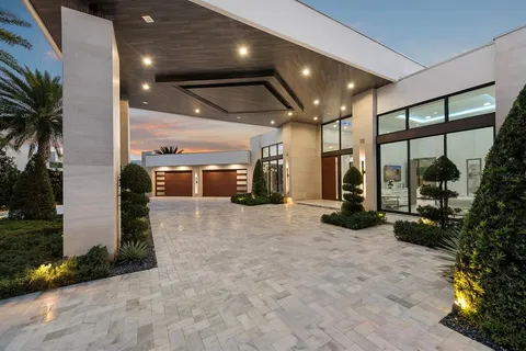 a view of a backyard with plants and lake view
