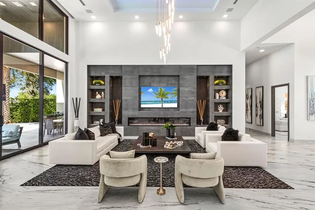 a lobby with furniture and floor to ceiling window