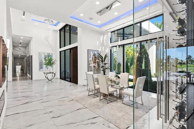 a spacious bedroom with a large bed and a large window