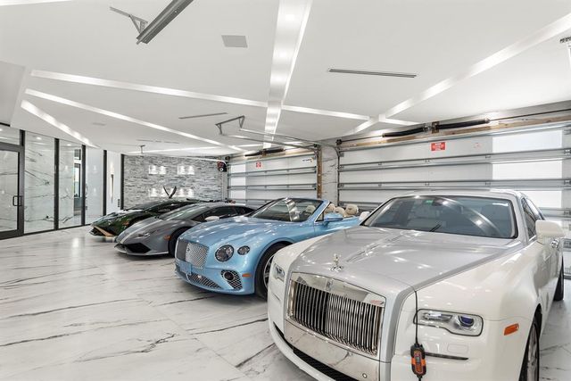 a living room with furniture a rug and a large window
